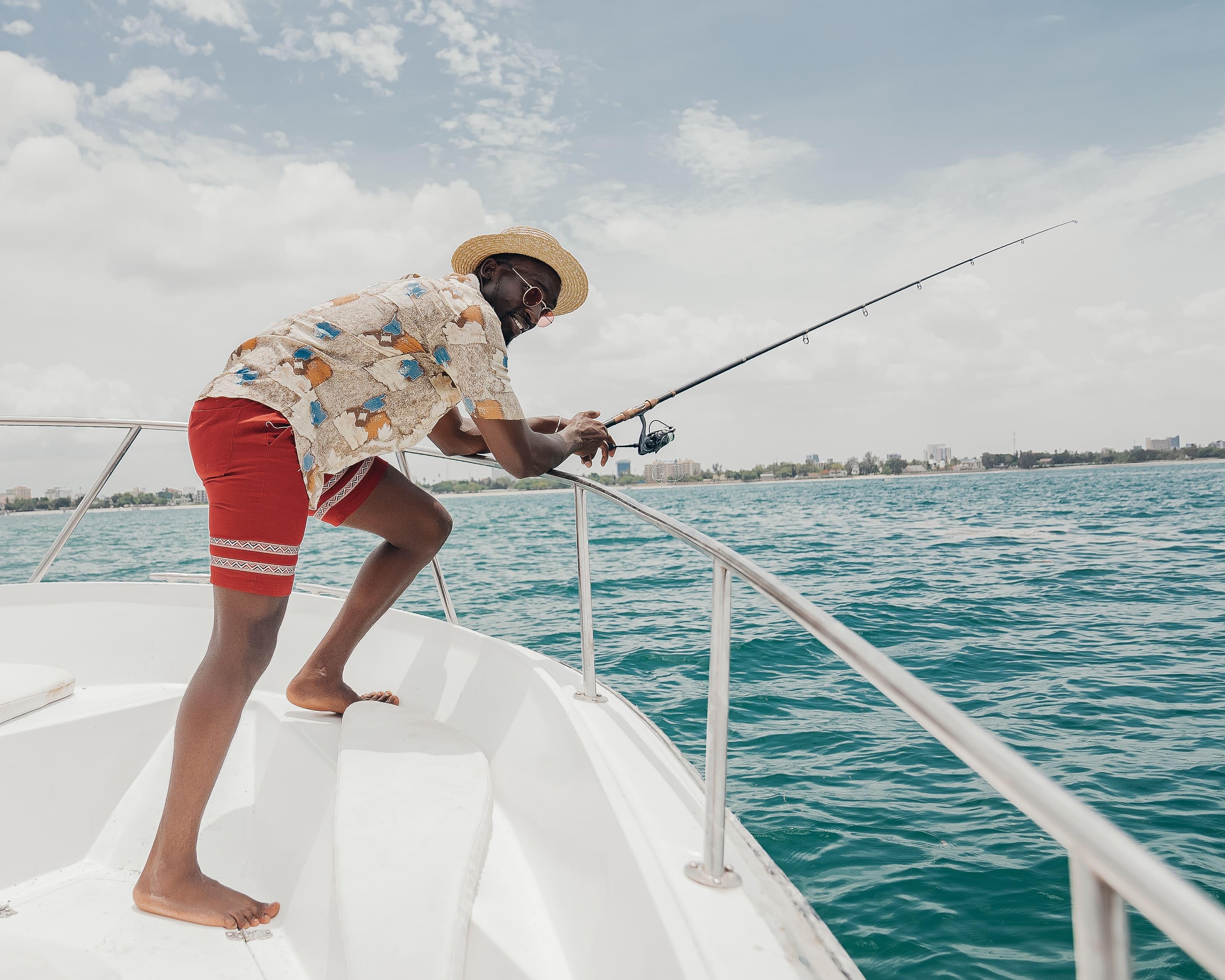 Tulum fishing charter; guy fishing on a yacht
